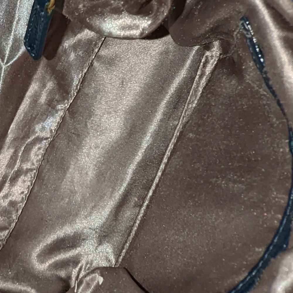 The  Sak navy blue patent leather hobo bag.